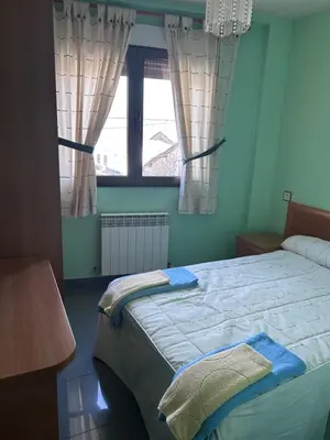Cama o camas de una habitación en Hostal Rural Dos Hermanos