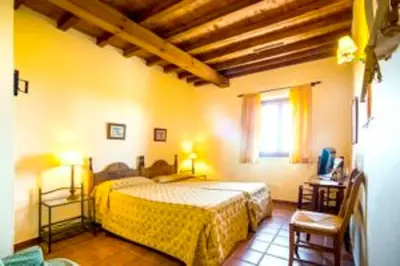 Cama o camas de una habitación en La Hostería de Oropesa