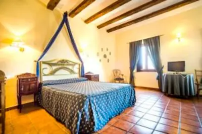 Cama o camas de una habitación en La Hostería de Oropesa