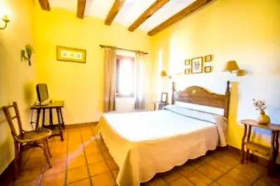 Cama o camas de una habitación en La Hostería de Oropesa