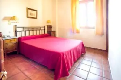 Cama o camas de una habitación en La Hostería de Oropesa