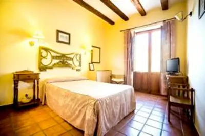 Cama o camas de una habitación en La Hostería de Oropesa