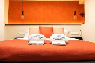 Cama o camas de una habitación en Qazris Suites