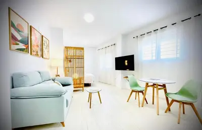 Una televisión o centro de entretenimiento en Apartamentos Guerrero