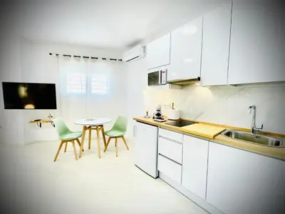 Una cocina o zona de cocina en Apartamentos Guerrero