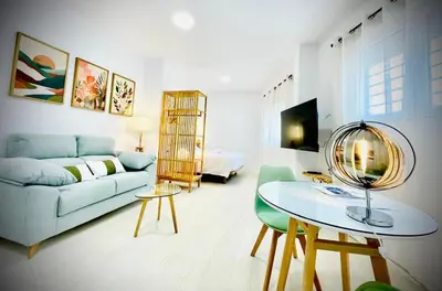 Una televisión o centro de entretenimiento en Apartamentos Guerrero