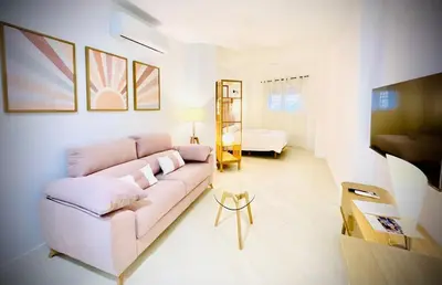 Una televisión o centro de entretenimiento en Apartamentos Guerrero