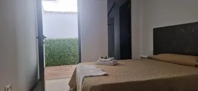 Cama o camas de una habitación en Hostal del Currante Babilafuente