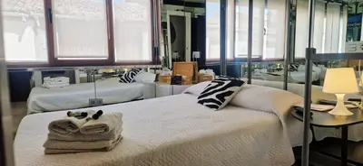 Cama o camas de una habitación en Hostal del Currante Babilafuente