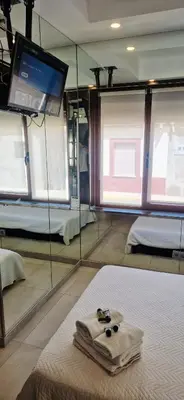 Cama o camas de una habitación en Hostal del Currante Babilafuente