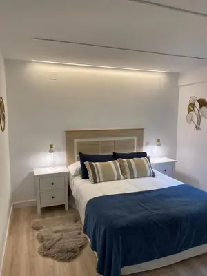 Cama o camas de una habitación en Apartamento Turístico HUGO DE PILAR