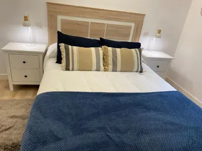 Cama o camas de una habitación en Apartamento Turístico HUGO DE PILAR