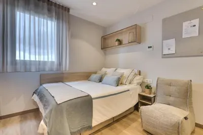 Cama o camas de una habitación en Livensa Living Salamanca Albergue Juvenil