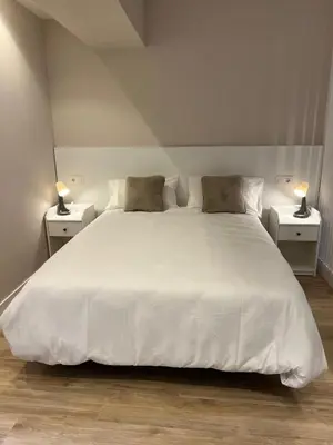 Cama o camas de una habitación en Apartamentos Titus Decimus
