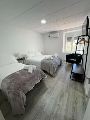 Cama o camas de una habitación en Hostal Las Cruceras
