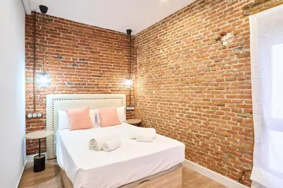 Cama o camas de una habitación en Apartamentos propia Plaza Mayor collection Luxury