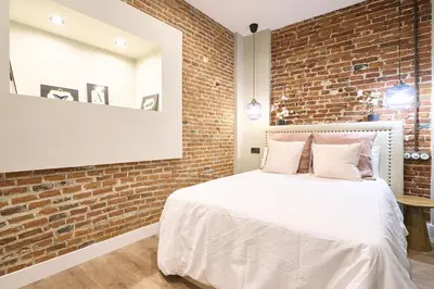 Cama o camas de una habitación en Apartamentos propia Plaza Mayor collection Luxury