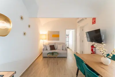 Una televisión o centro de entretenimiento en Apartamentos Turísticos Zibá