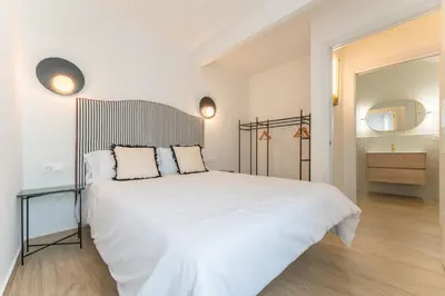 Cama o camas de una habitación en Apartamentos Turísticos Zibá