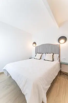 Cama o camas de una habitación en Apartamentos Turísticos Zibá