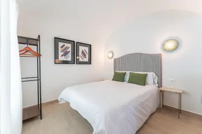 Cama o camas de una habitación en Apartamentos Turísticos Zibá