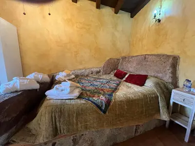 Cama o camas de una habitación en Cabachuelas I casas rurales