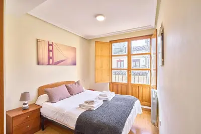 Cama o camas de una habitación en San Justo Suites