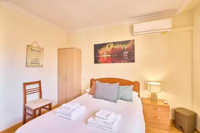Cama o camas de una habitación en San Justo Suites