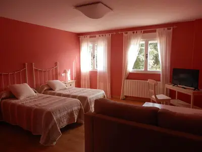Cama o camas de una habitación en Hostal Rural los Alisos