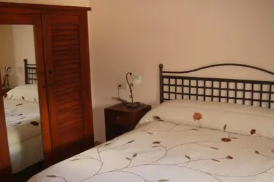 Cama o camas de una habitación en Hostal Rural los Alisos