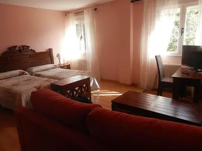Cama o camas de una habitación en Hostal Rural los Alisos