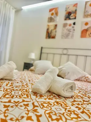 Cama o camas de una habitación en La Beltraneja XIII Apartamento con encanto en el casco histórico
