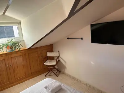 Una televisión o centro de entretenimiento en Vallespin Suite II