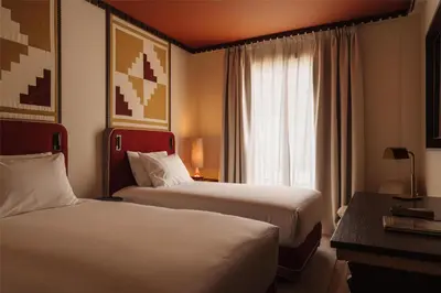 Cama o camas de una habitación en Palacio De Godoy Caceres, Curio Collection By Hilton