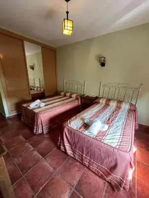 Cama o camas de una habitación en Hotel Rural Cristina