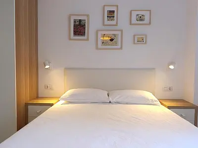 Cama o camas de una habitación en Destino Deluxe Helga Cáceres