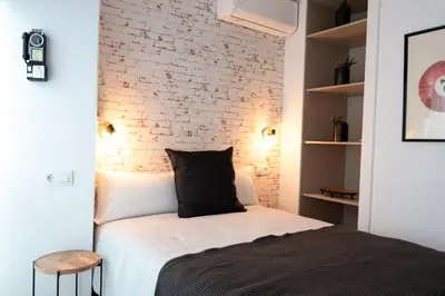 Cama o camas de una habitación en Apartamentos Eras Centro