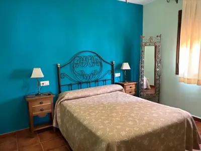 Cama o camas de una habitación en Apartamentos los Olivos