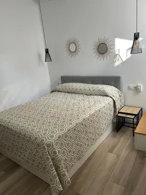 Cama o camas de una habitación en La casita de la plaza