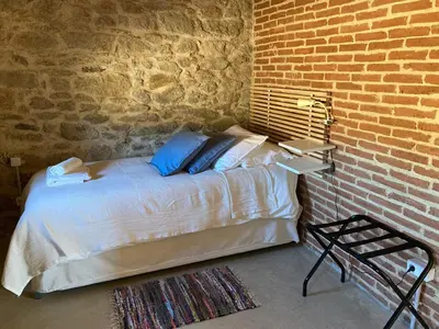 Cama o camas de una habitación en Villa Manfarita - 3 casitas y un jardín hechos con mucho mimo!
