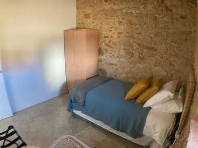 Cama o camas de una habitación en Villa Manfarita - 3 casitas y un jardín hechos con mucho mimo!