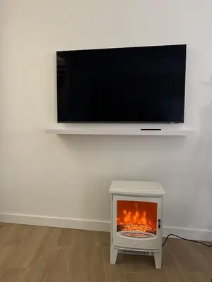 Una televisión o centro de entretenimiento en Apartamento en un lugar con encanto