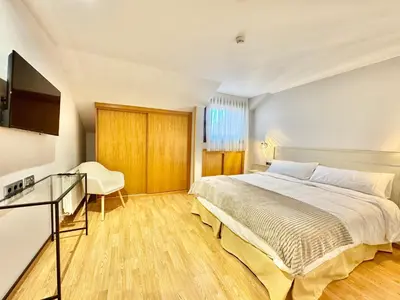 Cama o camas de una habitación en Hotel Ávila Diró