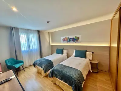 Cama o camas de una habitación en Hotel Ávila Diró