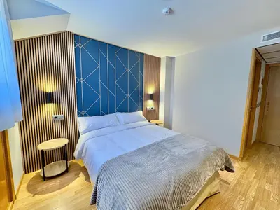 Cama o camas de una habitación en Hotel Ávila Diró