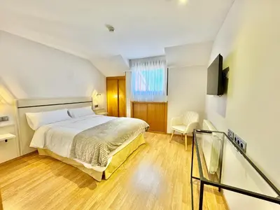 Cama o camas de una habitación en Hotel Ávila Diró