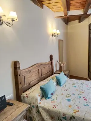 Cama o camas de una habitación en Hostal El Rincón del Trillo