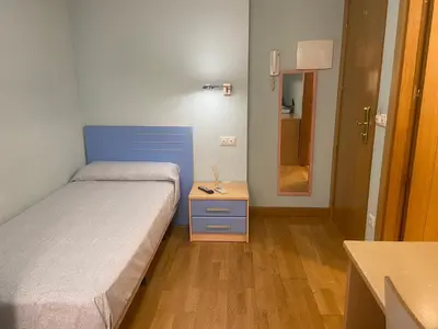 Cama o camas de una habitación en REMANAL Residencia