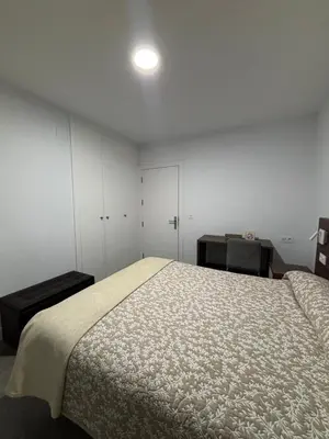 Cama o camas de una habitación en Hostal Los Rosales