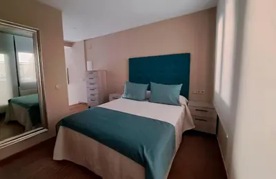 Cama o camas de una habitación en Apartamento La Monina CUEVAS DEL VALLE